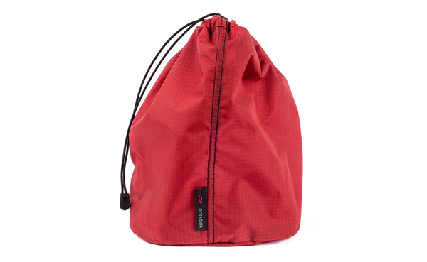 A Size 4 Sangria (red with light red grid) 210 Cerylon Travel Stuff Sack.